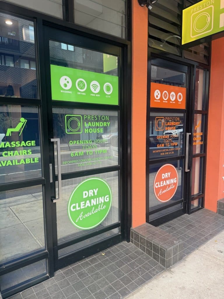 The Preston Laundry House shopfront on High Street, Preston, with signage for washing, drying, free Wi-Fi, dry cleaning and massage chairs